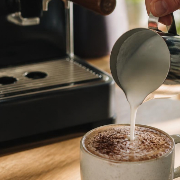 Frothed milk poured into a mug of mocha made with Chocolate MycoProtein